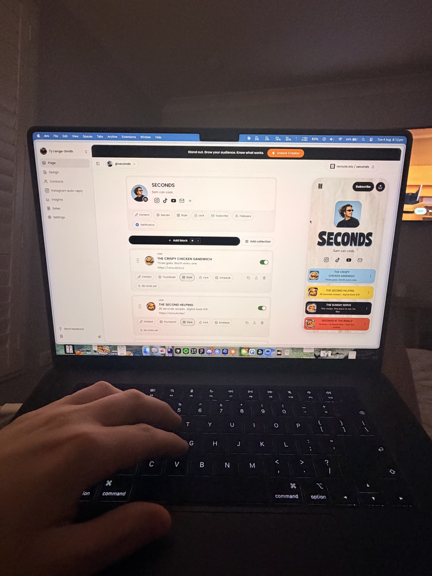 The Reroute page editor and live phone preview open on Ty’s laptop during a late-night work session